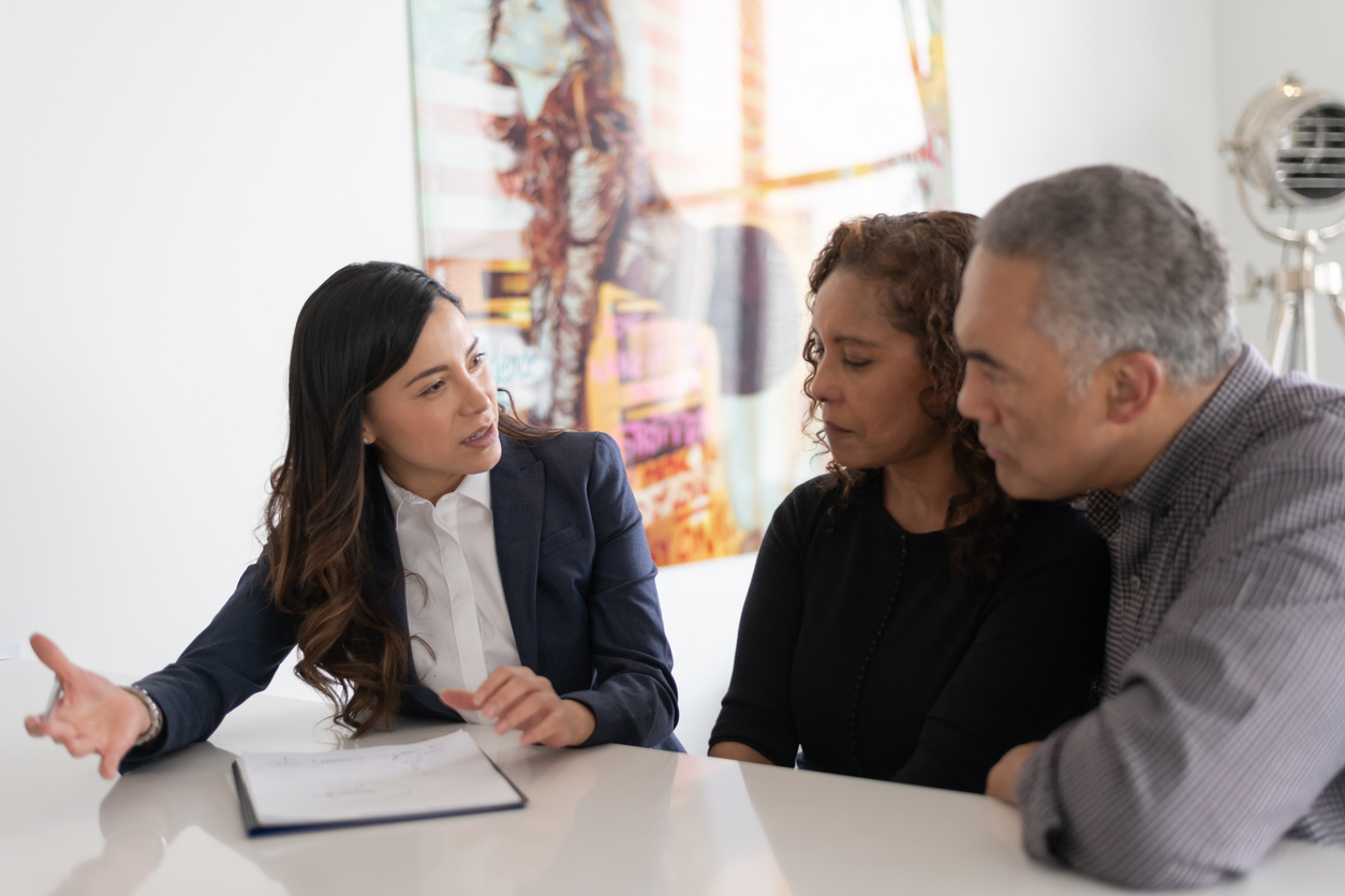 Couple talking with Attorney